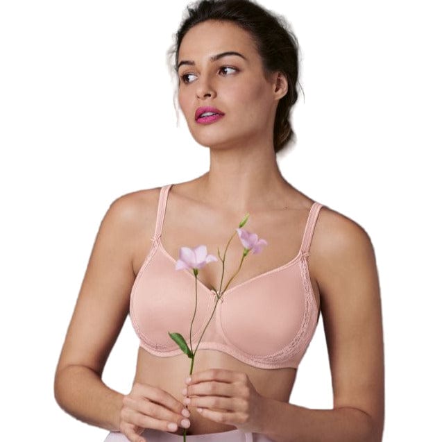 Woman wearing a pink Anita Rosa Faia Lace rose bra holding flowers against a white background