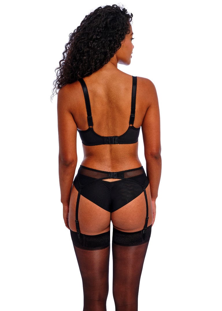 Back view of woman wearing Freya Loveland black suspender lingerie set on a white background