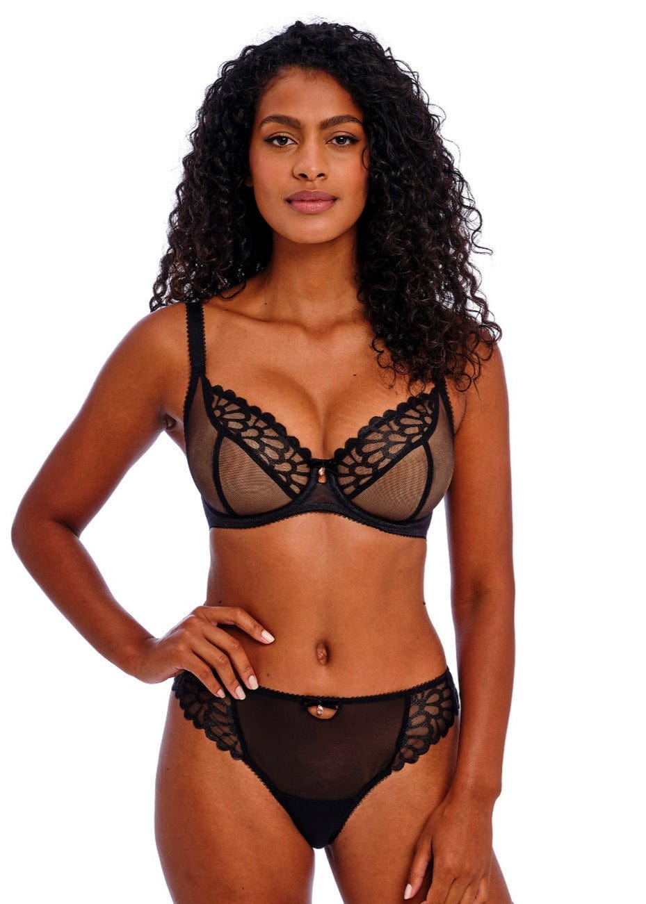 Woman wearing a Freya Loveland Plunge Lace Bra and matching briefs on a white background