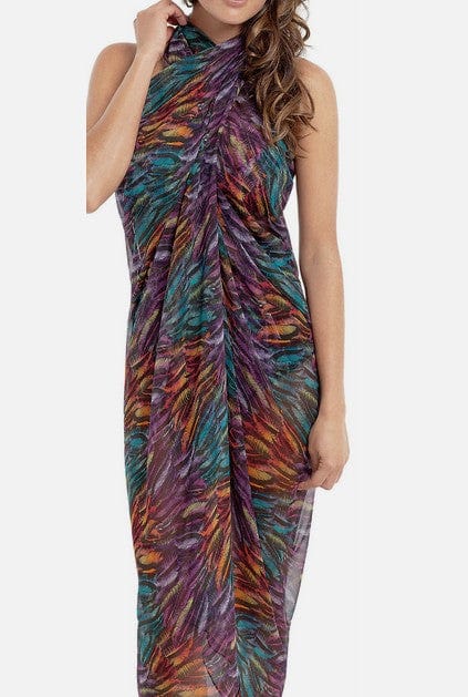 Woman wearing a colorful halter neck dress on a white background