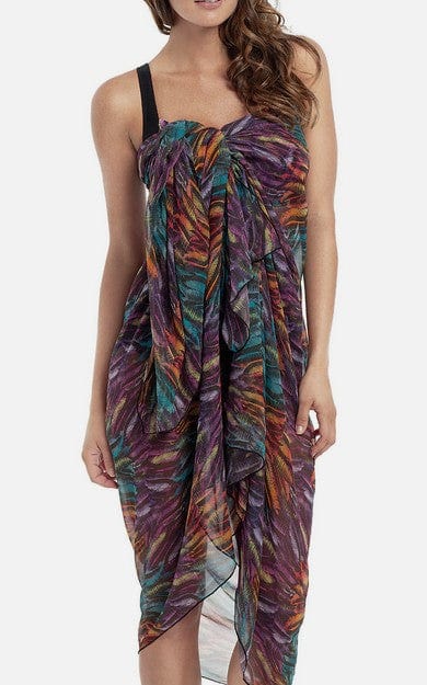 Woman wearing a colorful, patterned dress on a white background