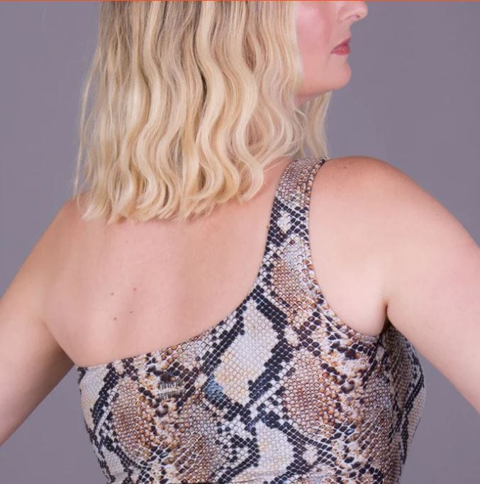 Person wearing a snake print mastectomy swimsuit back view from Envie Lingerie