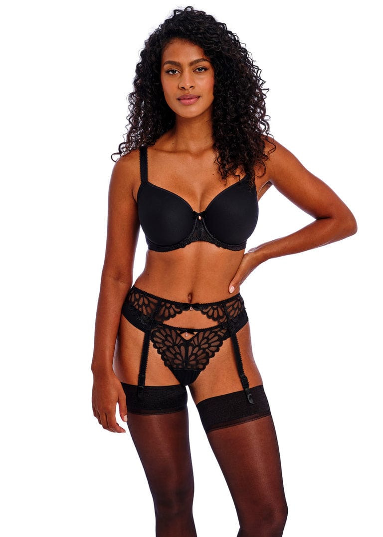 Woman wearing a Freya Loveland black ssuependers and brief set on a white background