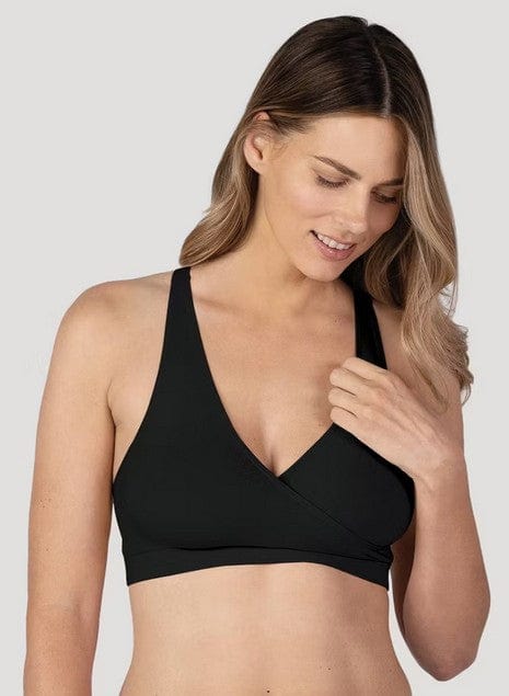 Pregnant woman wearing Bravado! Basics black crossover sleep bra for maternity support