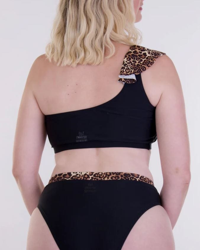 Back View of mastectomy bikini top with leopardskin right hand off the shoulder strap.