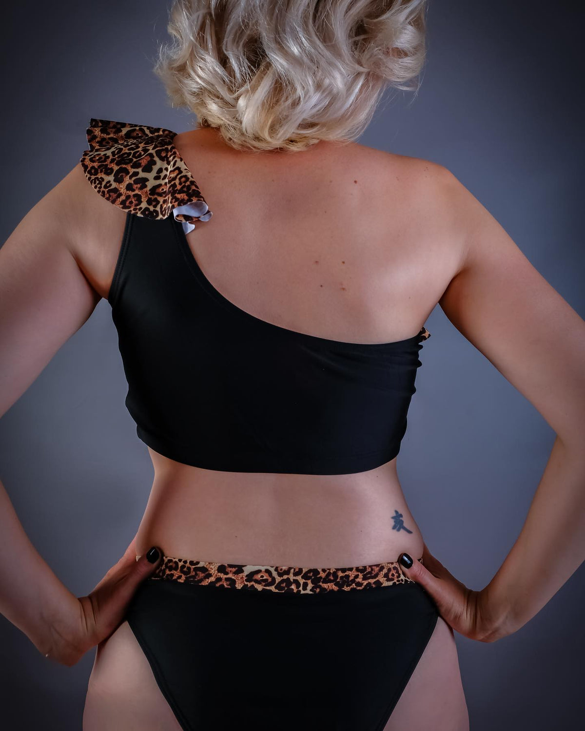 Mastectomy bikini top with off the shoulder leopardskin frill on left shoulder